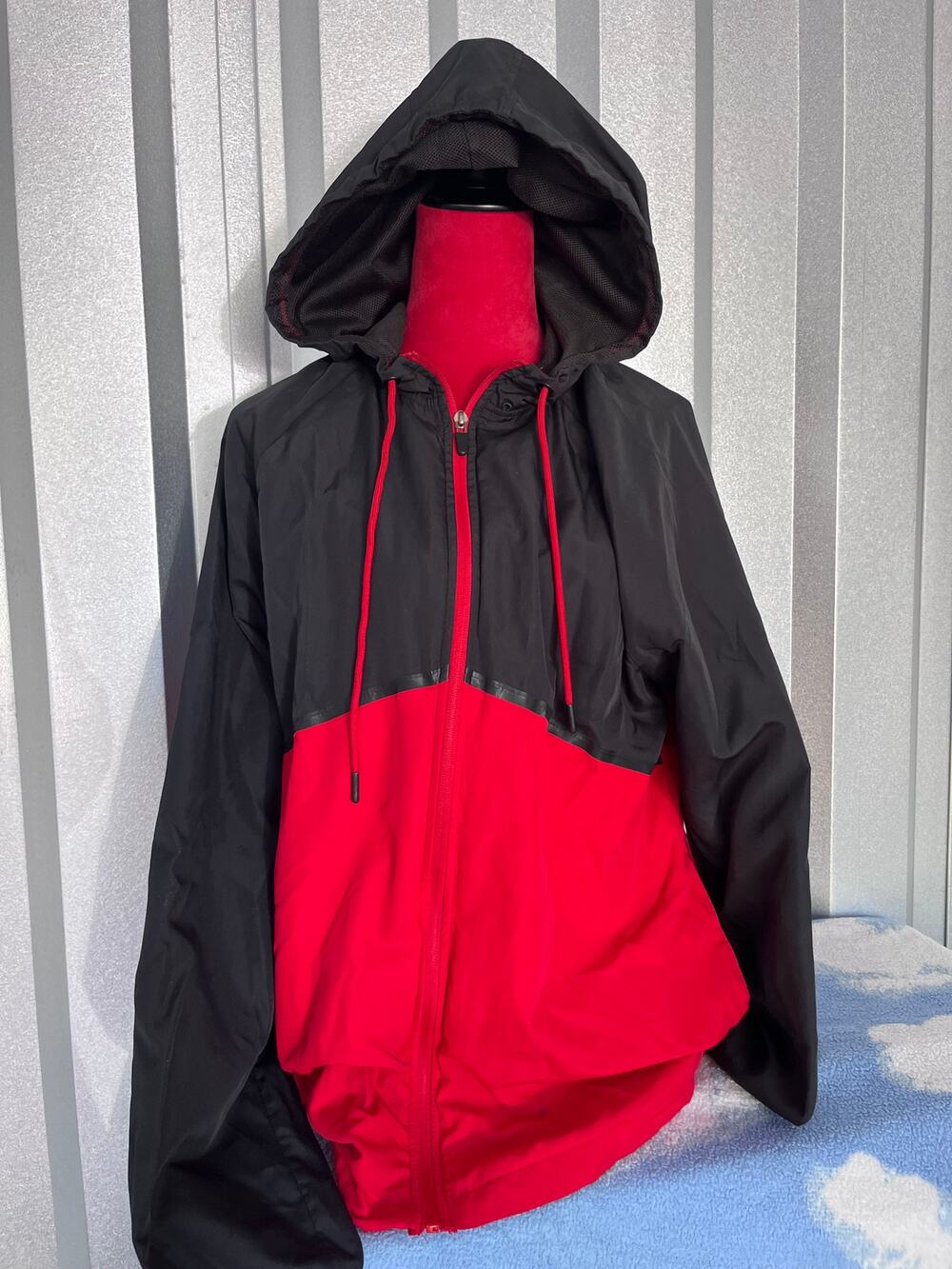Red and black windbreaker coat
